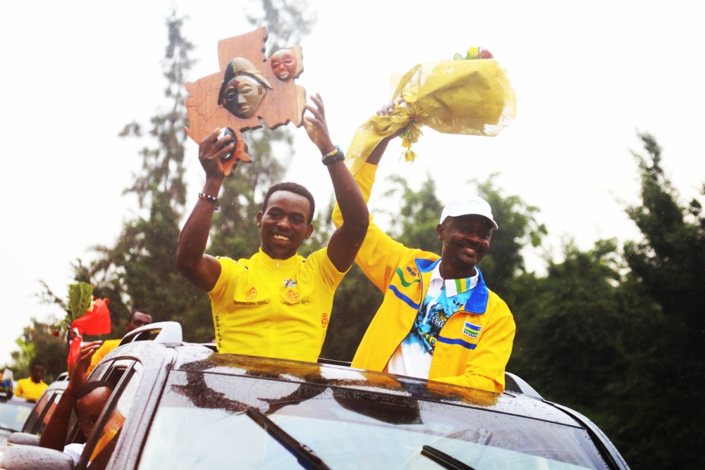 The winner Joseph Areruya and Team Rwanda coach Felix Sempoma during a fanfare reception of Team Rwanda after winning La Tropicale in 2018. Sam Ngendahimana