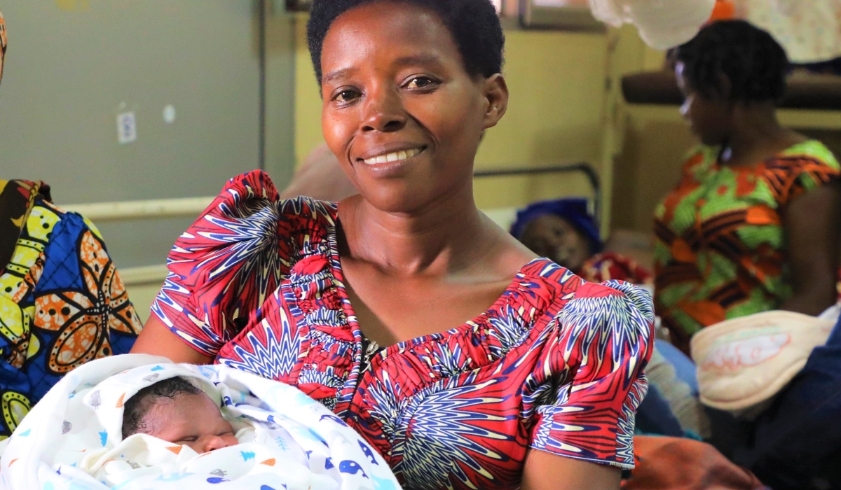 A woman with her newborn at Kacyiru Hospital. According to numbers  from four major hospitals in Kigali at least 70 babies were born on January 1,. Craish Bahizi