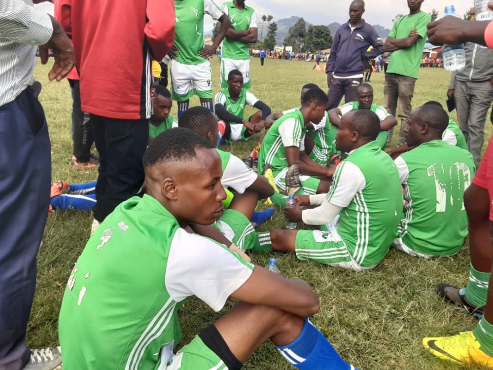 Players follow the coach&#039;s instructions during half time at the game of Umurenge Kagame Cup competition in Busasamana Sector, Rubavu District ,on Saturday, January 7. Germain Nsanzimana