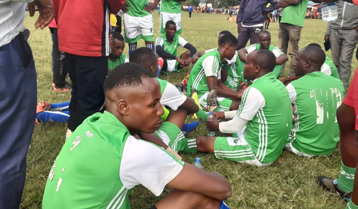 Players follow the coach&#039;s instructions during half time at the game of Umurenge Kagame Cup competition in Busasamana Sector, Rubavu District ,on Saturday, January 7. Germain Nsanzimana
