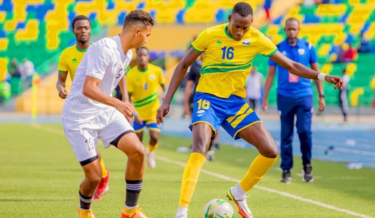 Striker Arthur Gitego dribbles past a Libya’s defender during the second leg match of the first round of the preliminary stages of the 2023 AFCON U-23. Courtesy