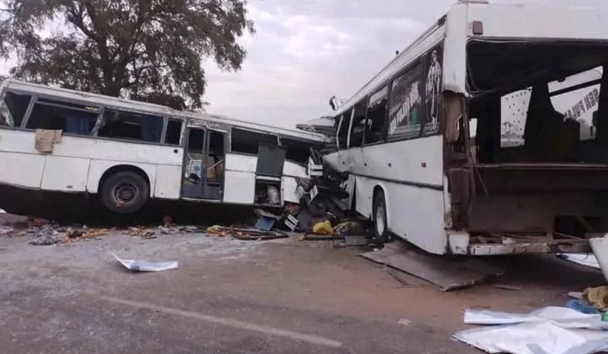 Two damaged buses are pictured after they collided on a road in Gniby, Senegal, on Sunday. At least 40 people were killed and dozens injured in crash. / Elimane Fall via AP