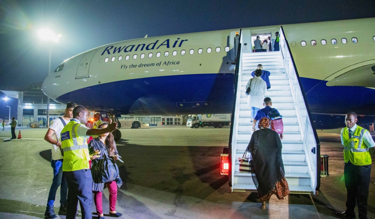 Passengers board RwandAir&#039;s plane at Kigali International Airport in 2020. President Paul Kagame has asked the Prime Minister to put restrictions on unnecessary foreign travel by public servants. File