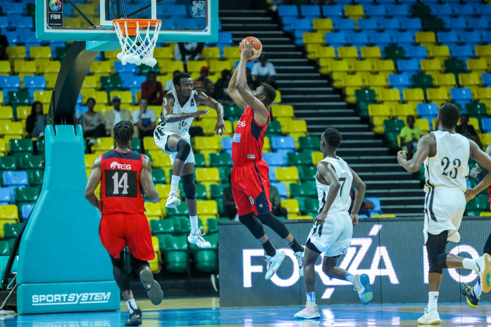 REG and Patriots players during a past league game. The Rwanda Basketball League will resume on
Friday January 13. File
