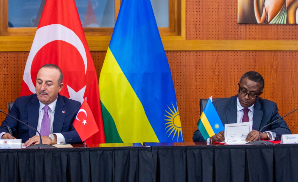 Vincent Biruta, Rwanda’s Minister of Foreign Affairs and his Turkish counterpart, Mevlüt Çavuşoğlu sign the agreement in Kigali on Thursday, January 12. Photo by Olivier Mugwiza
