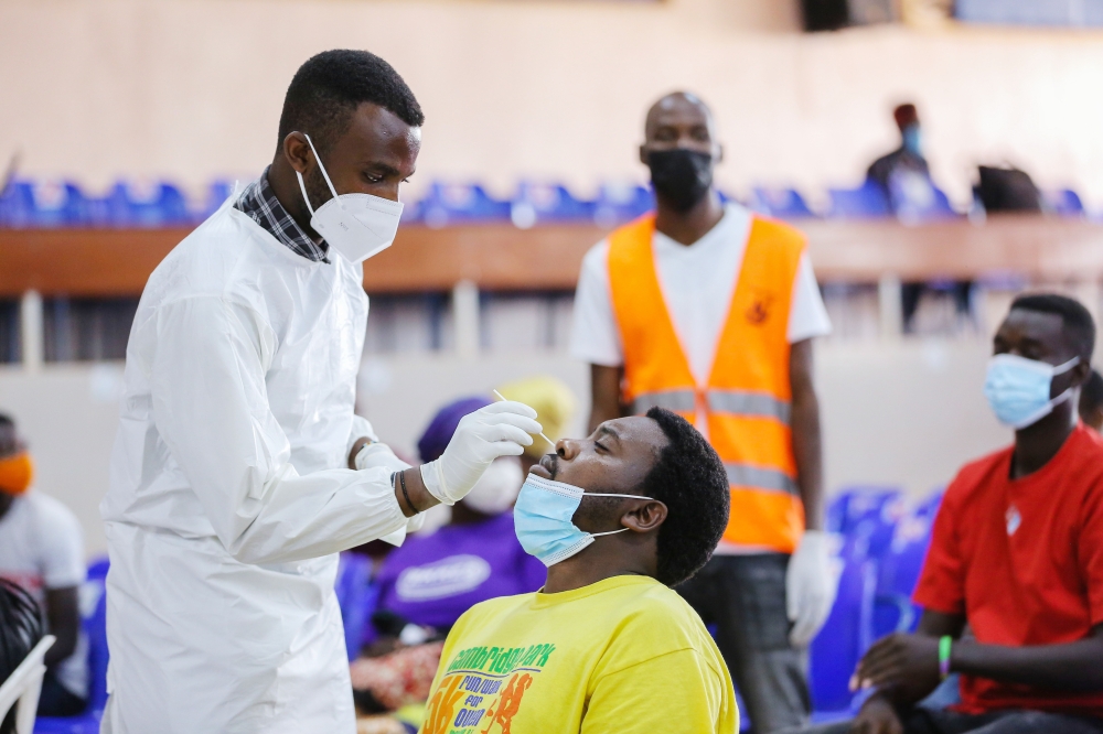 A health worker conducts the Covid 19 mass testing exercise in Kigali on July 23, 2021. The recently bout of flu which intensified during the rainy season left children and adults sick and weak. File
