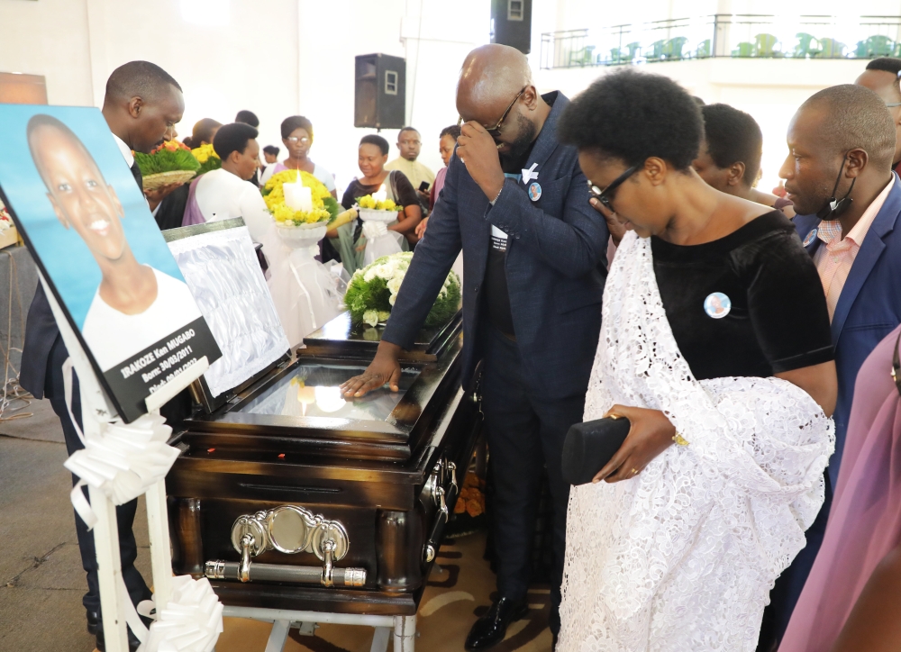 Gad Niyomugabo, the father of Late Ken Irakoze Mugabo, and the mother while bidding farewell to him at a requiem mass at ADEPR Remera in Kigali, on  Friday, January 13. Photos by Craish Bahizi
