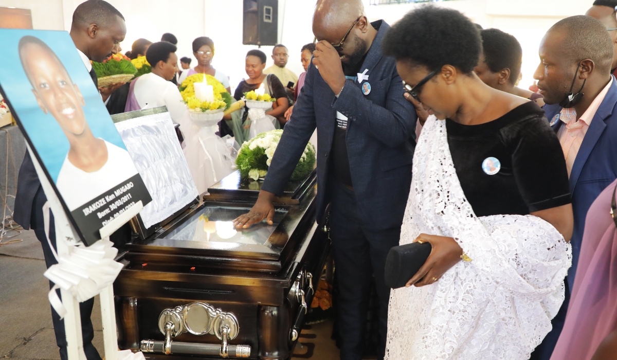Gad Niyomugabo, the father of Late Ken Irakoze Mugabo, and the mother while bidding farewell to him at a requiem mass at ADEPR Remera in Kigali, on  Friday, January 13. Photos by Craish Bahizi