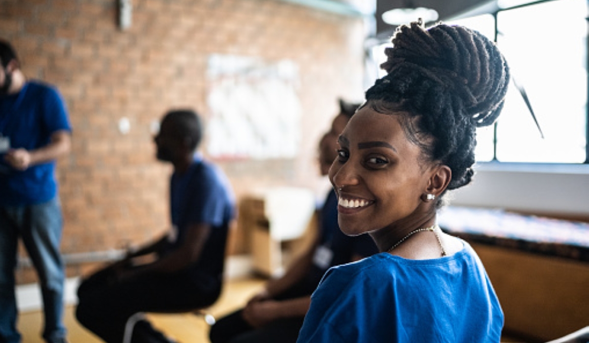 A young woman in a meeting at a community center.