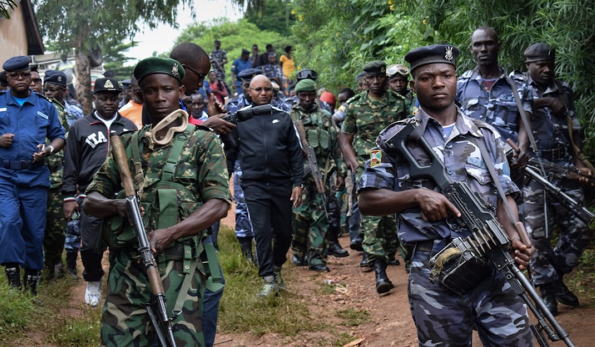 Burundi&#039;s minister of public security Alain-Guillaume Bunyoni (C) visits with other officials Ruhagarika village where 26 people were killed by the armed group in northwestern Burundi bordering with the Democratic Republic of Congo (DRC) on May 17, 2018, just days before the constitutional referendum that may allow the President Pierre Nkurunziza to remain in power until 2034. (Photo by STR / AFP)