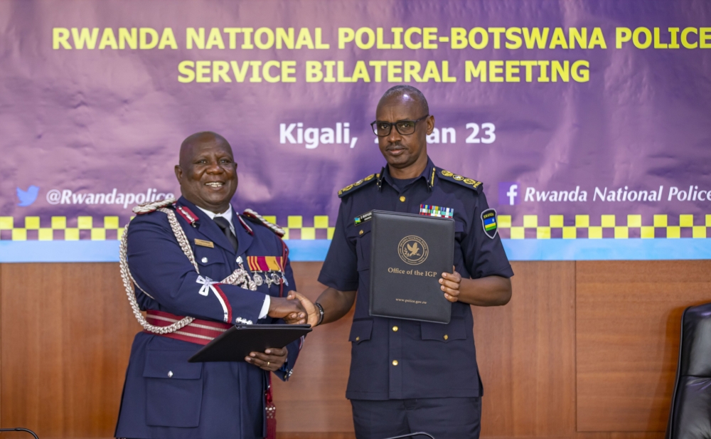 The Inspector General of Police, Dan Munyuza and  Botswana Police Service, Deputy Commissioner of Police , Phemelo Ramakorwane during the signing of a cooperation agreement between two institutions,  to formalize partnership in various areas of policing to combat transnational organized crimes, in Kigali on January 23, 2023. Courtesy