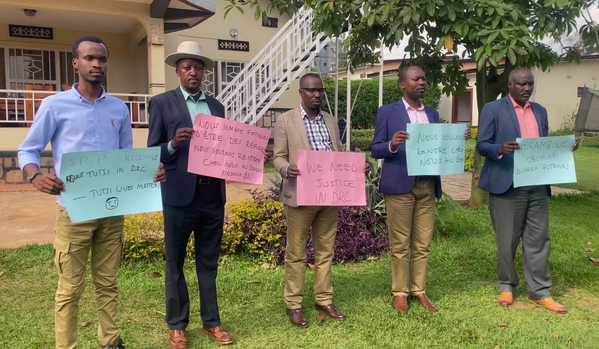 Representatives of the Congolese refugee community in Rwanda carried placards displaying the messages contained in the petition. Courtesy