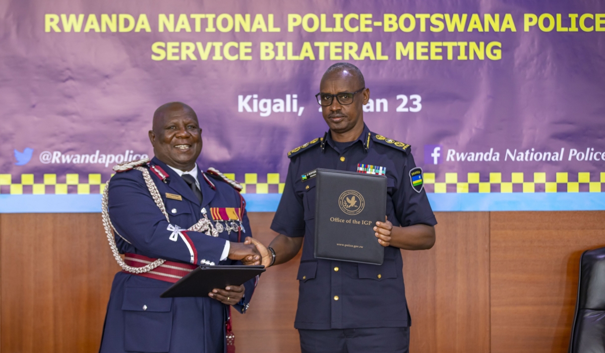 The Inspector General of Police, Dan Munyuza and  Botswana Police Service, Deputy Commissioner of Police , Phemelo Ramakorwane during the signing of a cooperation agreement between two institutions,  to formalize partnership in various areas of policing to combat transnational organized crimes, in Kigali on January 23, 2023. Courtesy