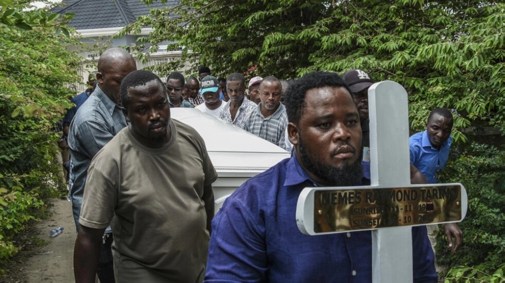 Mourners carry the coffin of Tanzanian student Nemes Tarimo who died fighting for Russia in Ukraine. Ericky Boniphace at AFP