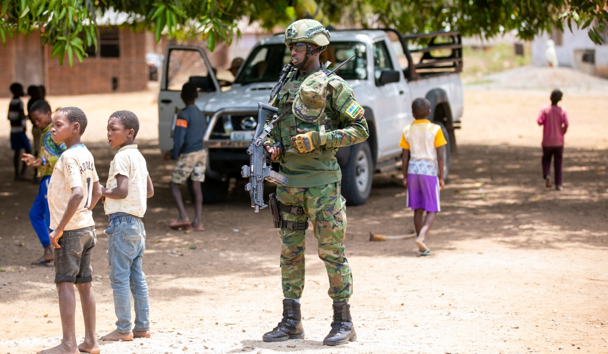A Rwandan soldier stands guard in one of the townships in Palma district where thousands of civilians returned to their homes, in September 2022. Photos by Olivier Mugwiza