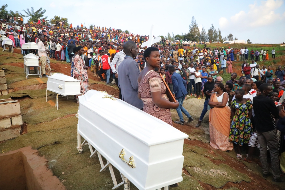 Mourners at the burial of victims of a fatal accident where a maize drying shelter collapsed, killing 10 people while more than 40 were injured. Nine of the victims were buried at   Rusororo  Cemetery on Sunday, February 5 . Photo by Craish Bahizi