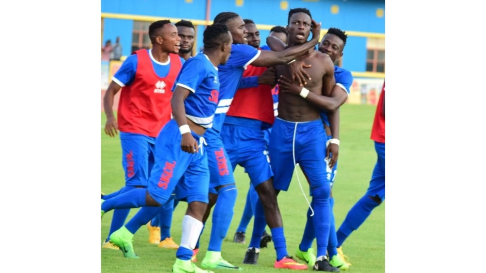 The Ghanaian striker Michel Sarpongo and teammates celebrate. He was the hero in Rayon Sports’ 1-0 win against APR FC on April 21, 2019 as the Blues” went on to win the league trophy. File