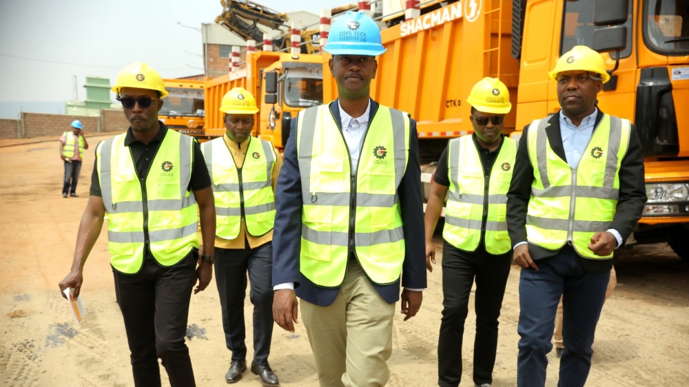 The Minister of Infrastructure, Ernest Nsabimana with other officials during a guided tour of the new machinery on February 10. All photos by Crasish Bahizi