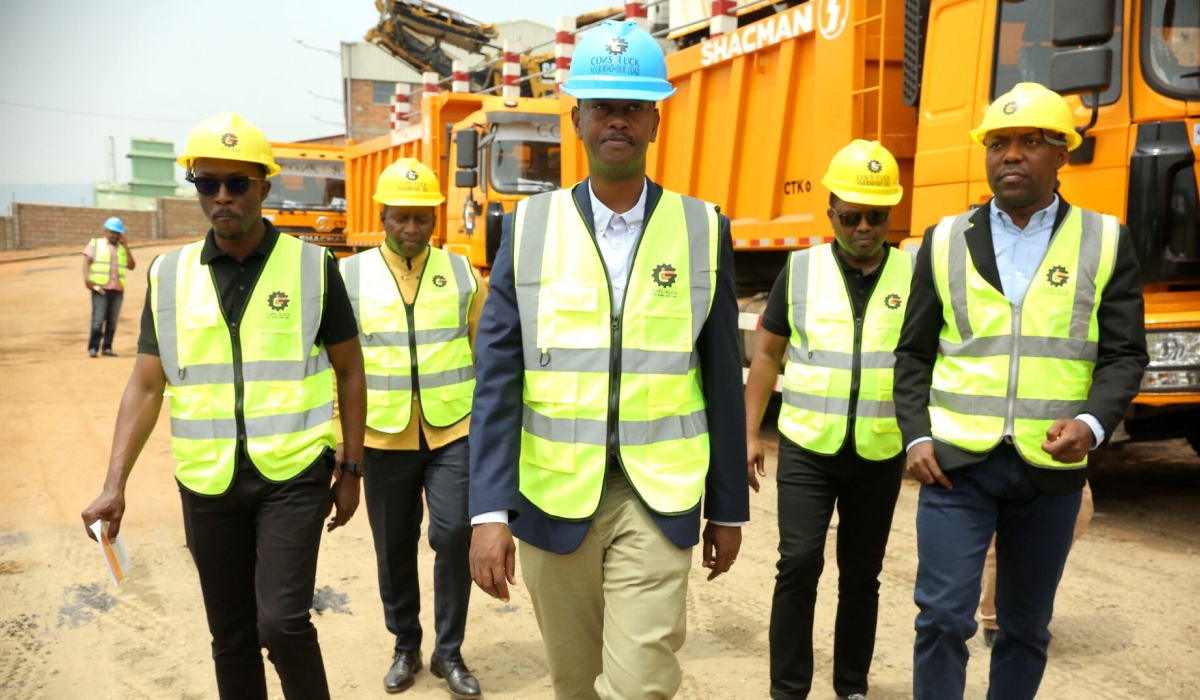 The Minister of Infrastructure, Ernest Nsabimana with other officials during a guided tour of the new machinery on February 10. All photos by Crasish Bahizi