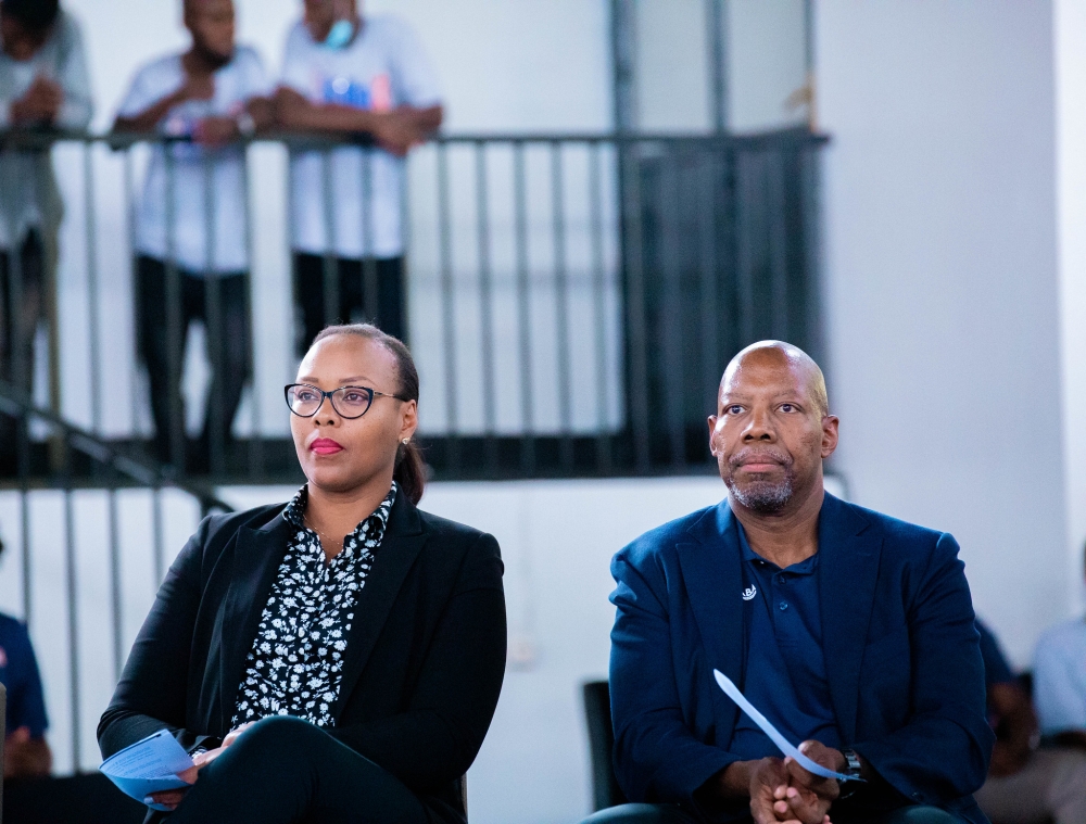 Minister of Sports Aurore Munyagaju and NBA Africa CEO, Victor Williams watch the game during the inauguration event. 