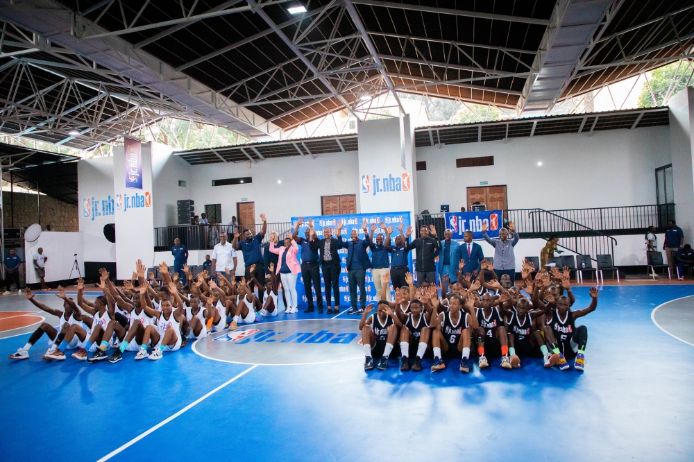 Officials and players in photo while celebrating the completion of the gymnasium at Lycee de Kigali on Friday, February 10