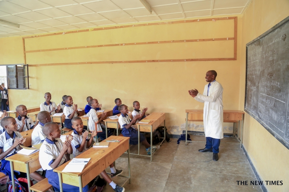 A teacher presiding over lectures at SOS Kacyiru in Kigali. Normally, students were reporting to school between 07a.m and 08a.m. students will now have to start school at 08.30am. Craish Bahizi