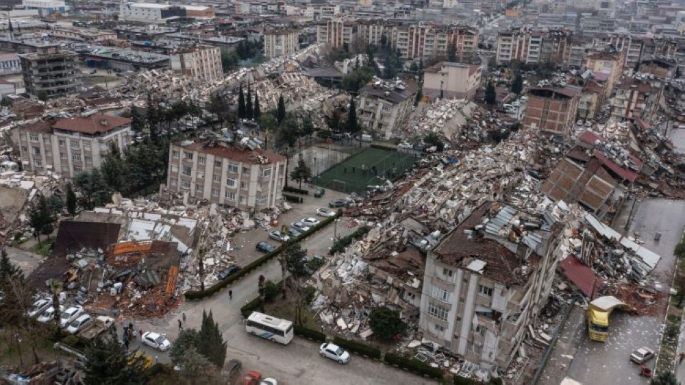 An aerial view of debris of collapsed buildings after a 7.8 magnitude earthquake hit Turkey and Syria on February 6, 2023. (Photo by Ercin Erturk/Anadolu Agency via Getty Images)