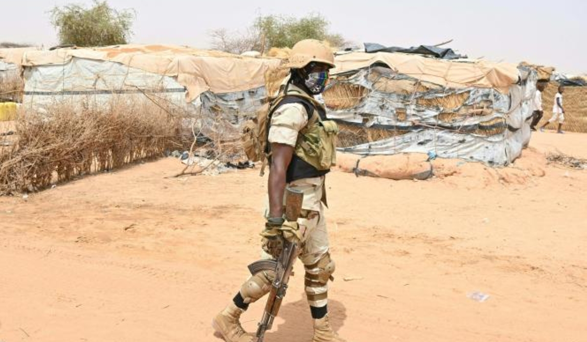 A Nigerien soldier patrols at an internally displaced persons (IDP) camp in Ouallam, Niger. At least ten soldiers were killed in an ambush by a group of "armed terrorists" in southwestern Niger, the ministry of defence said on February 11. Photo by AFP