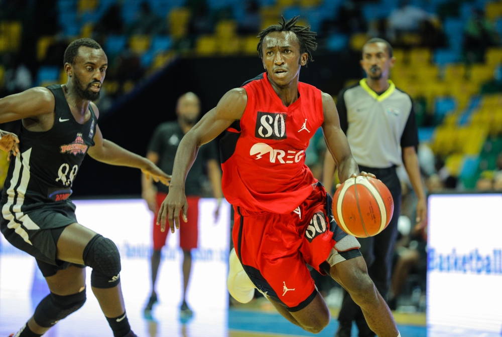 REG basketball point guard Jean Jacques Wilson Nshobozwabyosenumukiza with the ball during a league game. Rwanda Energy Group (REG)  will play Nigeria’s Kwara Falcons on March 12. File