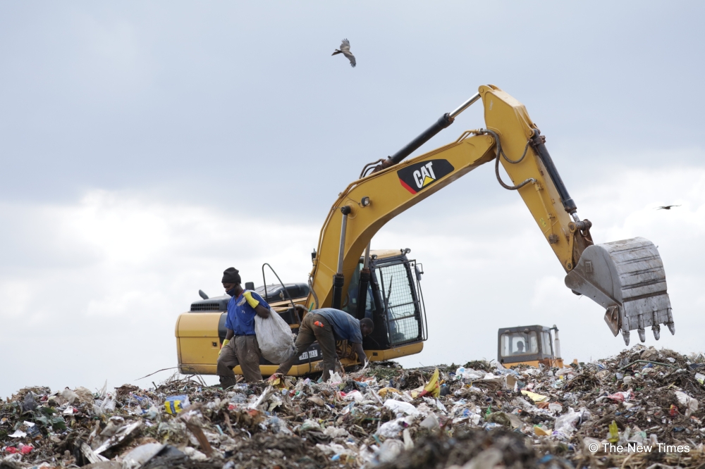 Workers sort garbage at Nduba landfill in Gasabo District inKigali. According to the city official more than Rwf3 billion is needed for expropriation to pave way for the construction of Nduba modern sa