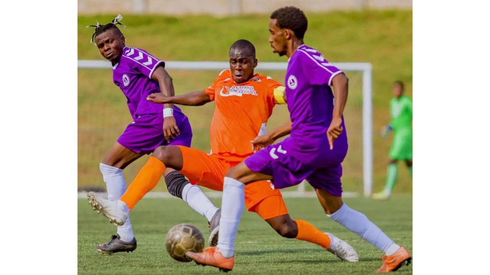 Sunrise FC players and AS Kigali&#039;s Bashiri vie for the ball during a 2-2 draw at  Bugesera Stadium in Nyamata on Thursday. COURTESY