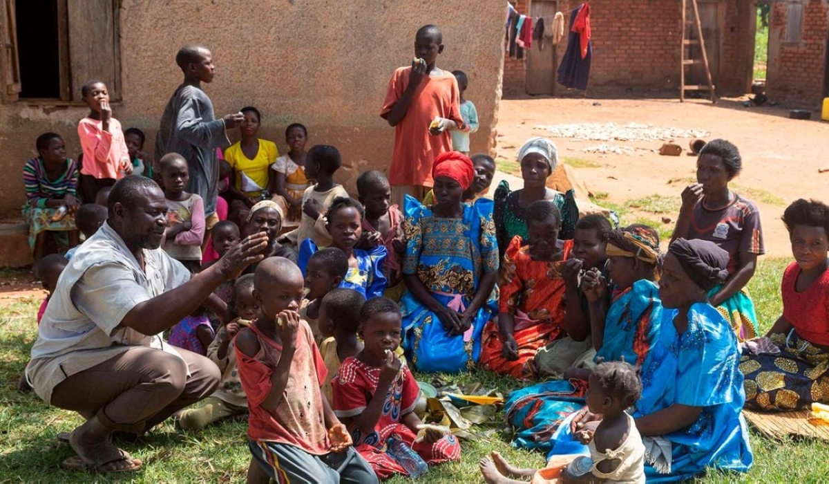 Musa Hasahya interacts with some of his wives, children and grandchildren outside their family home. He is struggling to provide for his 12 wives, 102 children and 578 grandchildren. PHOTO | BADRU KATUMBA | AFP