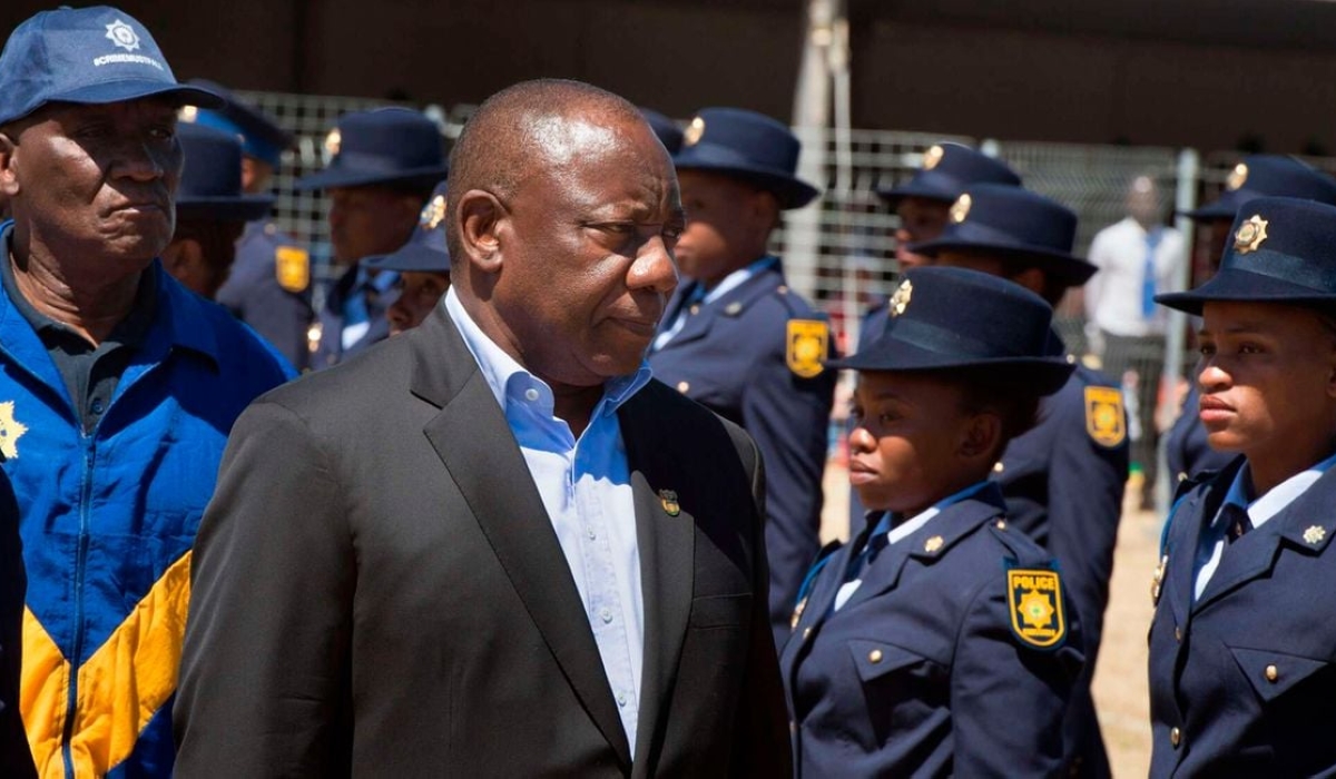 South-Africa&#039;s President Cyril Ramaphosa (R) and Police Minister Bheki Cele inspecting a guard of honour. Crime statistics released on February 17, 2023 by South Africa police minister revealed rape and murder cases increased significantly in the country in just three months. Photo by AFP
