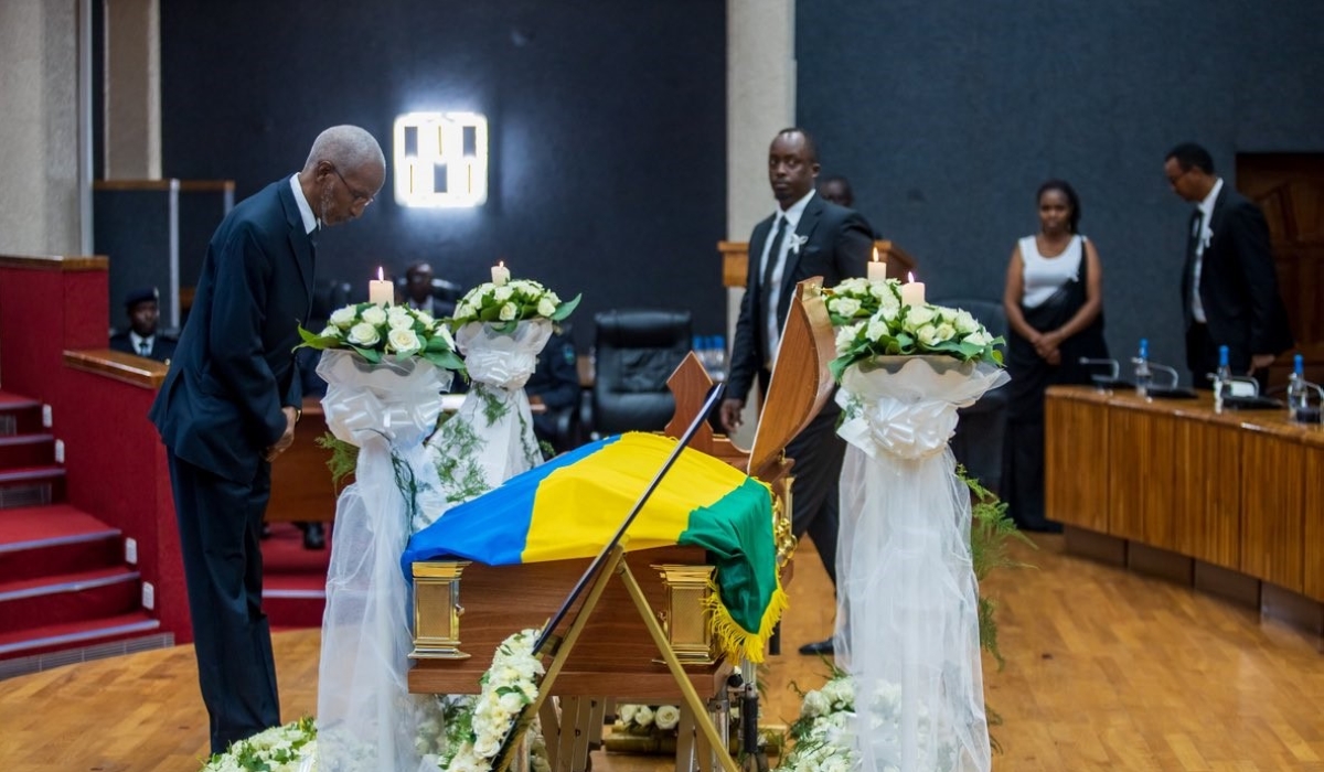 RPF Secretary General François Ngarambe pays tribute to Late Rwigamba during the  lying-in-state ceremony at Parliament, on Sunday, February 19. Courtesy