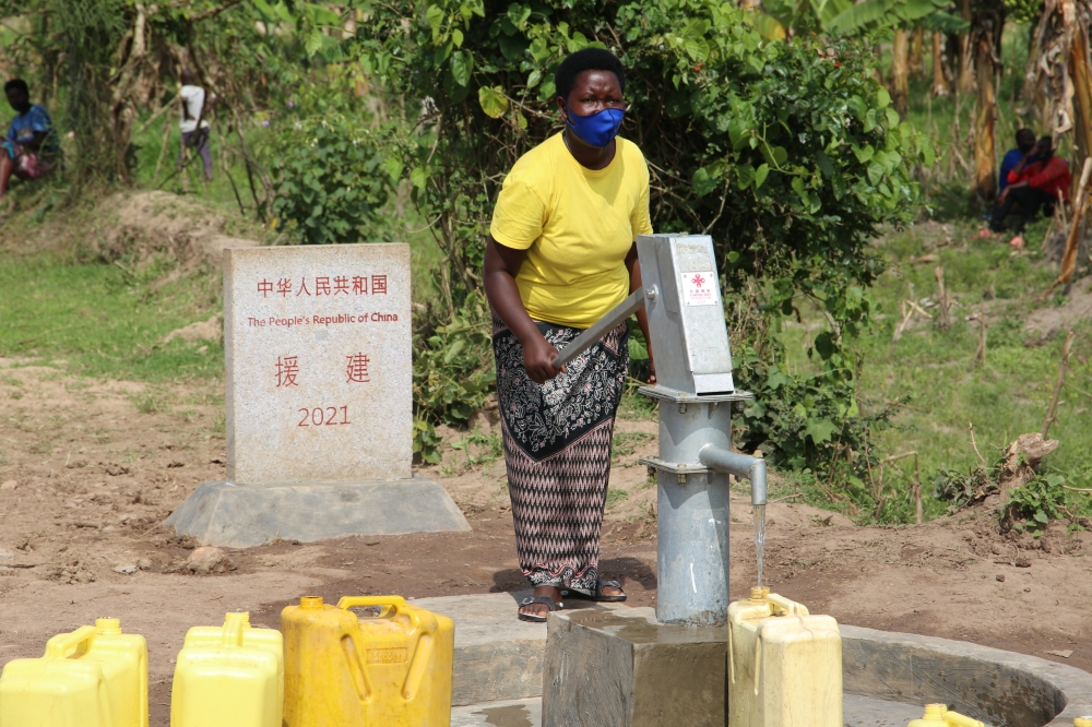 A woman fetching water at a borehole in Kirehe.Currently nearly 420 million Africans still lack basic drinking water today, or one in three inhabitants and 780 million people. Craish Bahizi