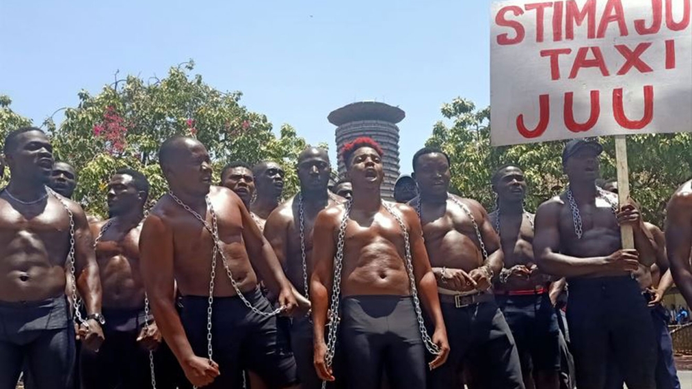 Comedian Eric Omondi and other protesters outside Parliament Buildings on February 21, 2023.