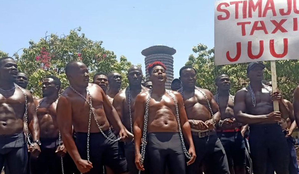 Comedian Eric Omondi and other protesters outside Parliament Buildings on February 21, 2023.