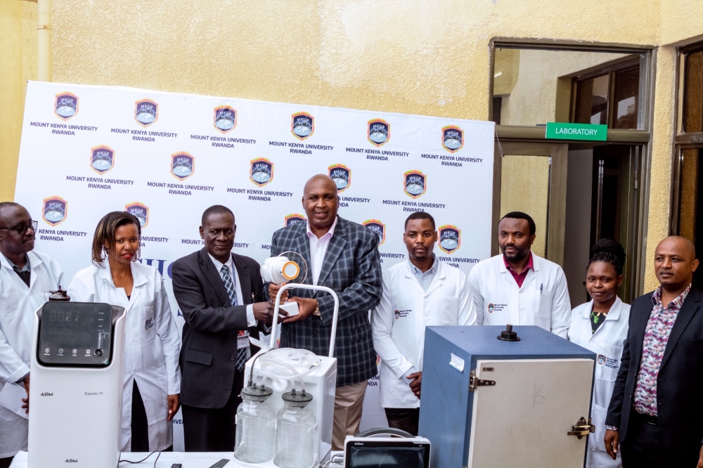 Prof. Simon Gicharu hands over new health equipment for the upcoming University Clinic to Prof. Edwin Odhuno  as some staff of the School of Health Sciences look on. The clinic is expected to support students in learning and the community as well.