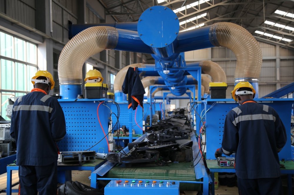 Workers at the National E-Waste Recycling Facility in Bugesera industrial zone that was established to promote development of other districts. Courtesy
