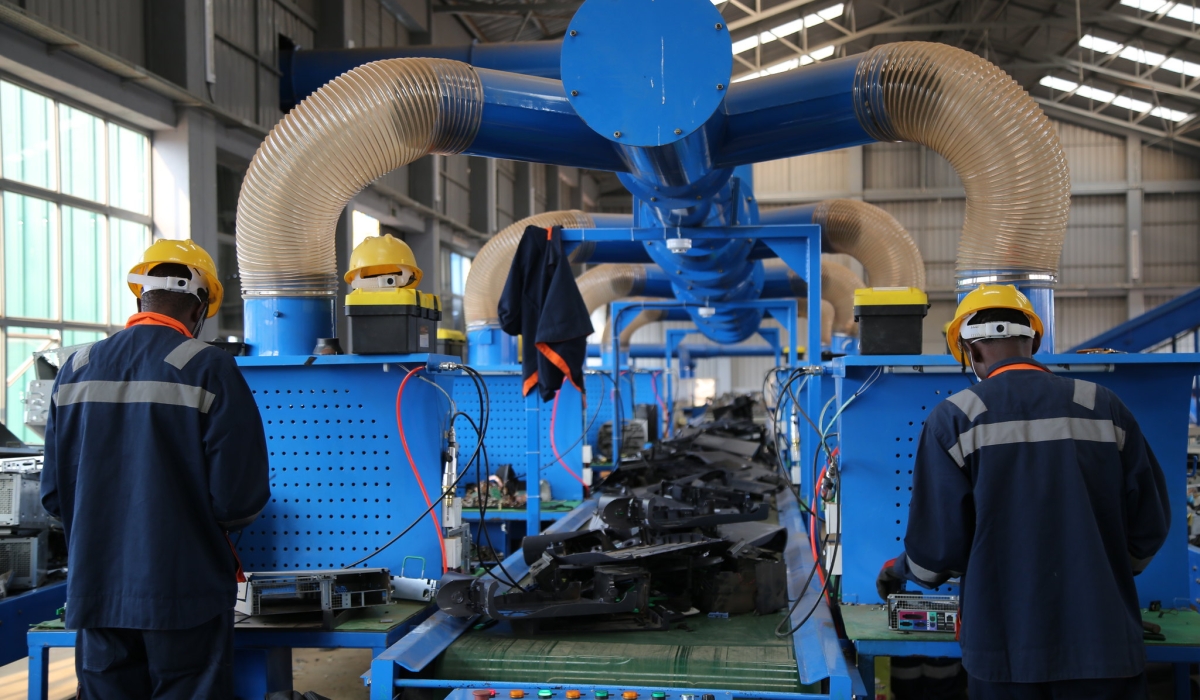 Workers at the National E-Waste Recycling Facility in Bugesera industrial zone that was established to promote development of other districts. Courtesy