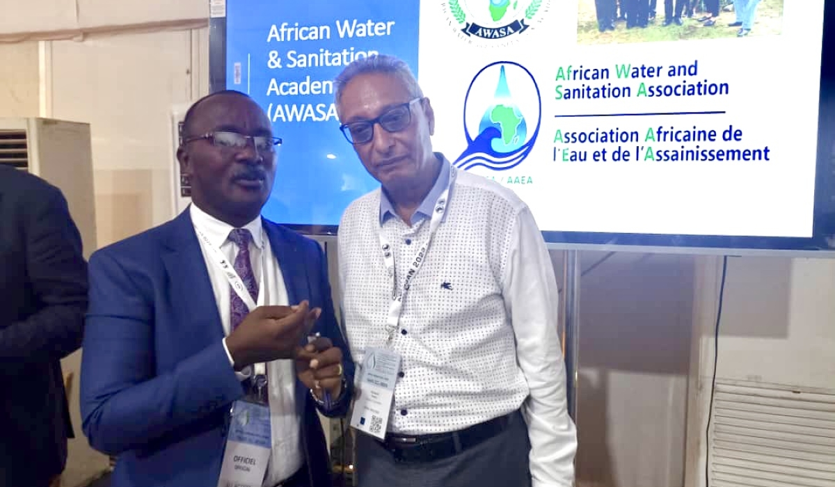 Eng. Silver Mugisha, the president of AfWaSA(L), and Prof. Hamanth Kasan the chair of strategic capacity building committee AfWaSA, during the water and sanitation conference in Abidjan.