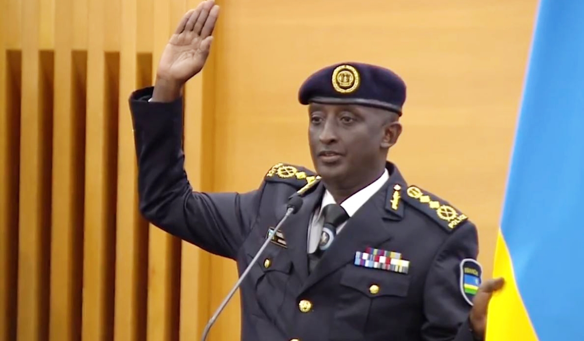 The newly appointed  Inspector General of Police Felix Namuhoranye takes oath during the swearing-in ceremony in Kigali on Friday, February 24.