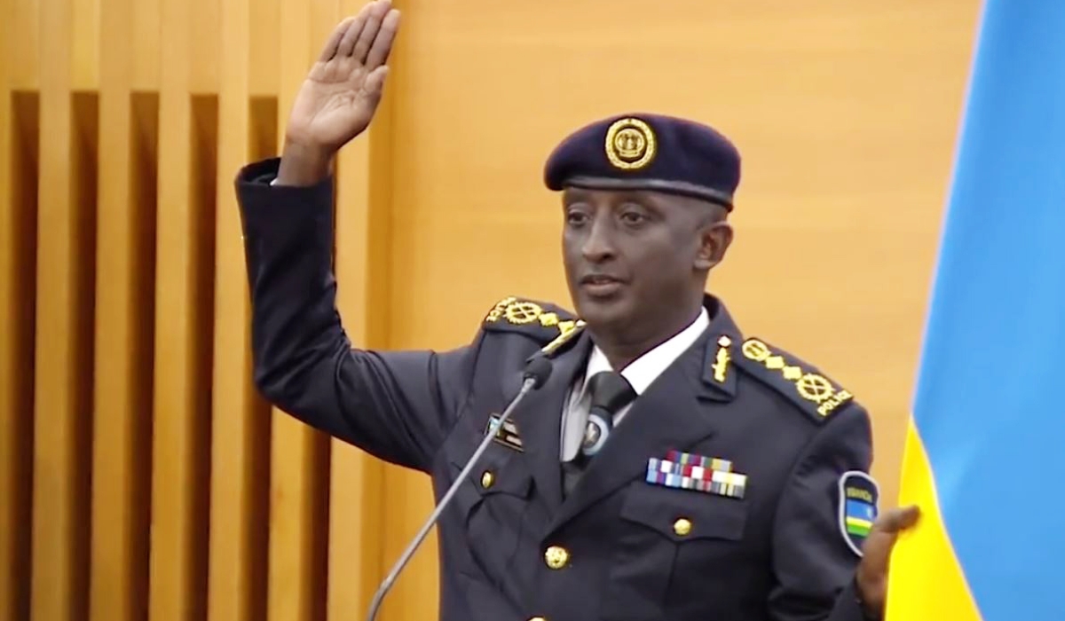 The newly appointed  Inspector General of Police Felix Namuhoranye takes oath during the swearing-in ceremony in Kigali on Friday, February 24.