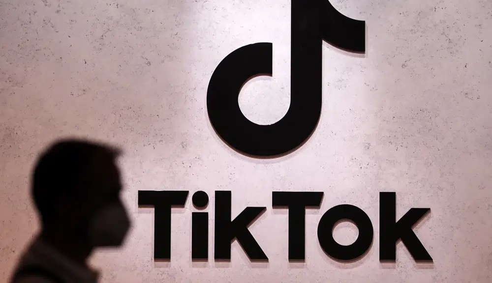 A visitor passes the TikTok exhibition stands at the Gamescom computer gaming fair in Cologne, Germany, Thursday, Aug. 25, 2022. The European Union&#039;s executive arm said Thursday, Feb. 23, 2023 it has temporarily banned TikTok from phones used by employees as a cybersecurity measure, reflecting growing worries from authorities over the Chinese-owned video sharing app. Photo by AP