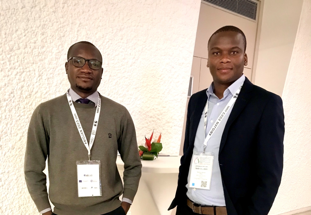 (L-R) Claydon Mumba Kanyunge, an AfWaSA member in Zambia, and Arnold Nduduzo Msibi, a young water professional in Swaziland posing for a photo during the African Water Association International Congres