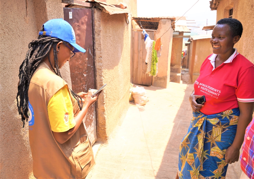 An enumerator interacts with a resident during the National Census in Kimihurura sector on Aug 16. Craish Bahizi