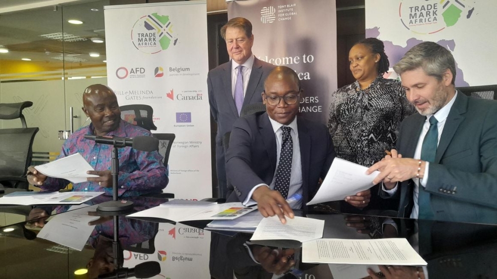 Trademark Africa CEO David Beer (right) signs an MoU with Tony Blair Institute Africa Managing Director Rishon Chimboza (centre) and Trade Catalyst Africa Chairman Patrick Obath (left) in Nairobi Kenya on February 27, 2023. Photo by NMG