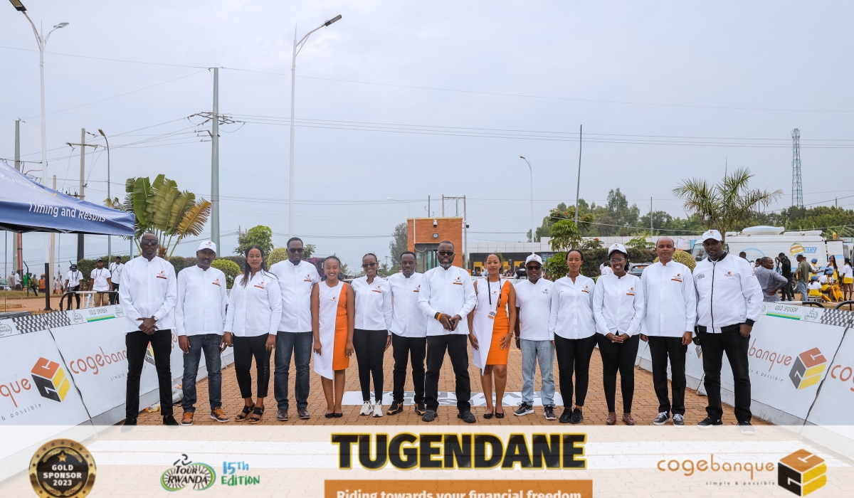 Cogebanque Plc&#039;s crew member  pose for a picture during the closing ceremony of Tour du Rwanda at Rebero  in Kigali