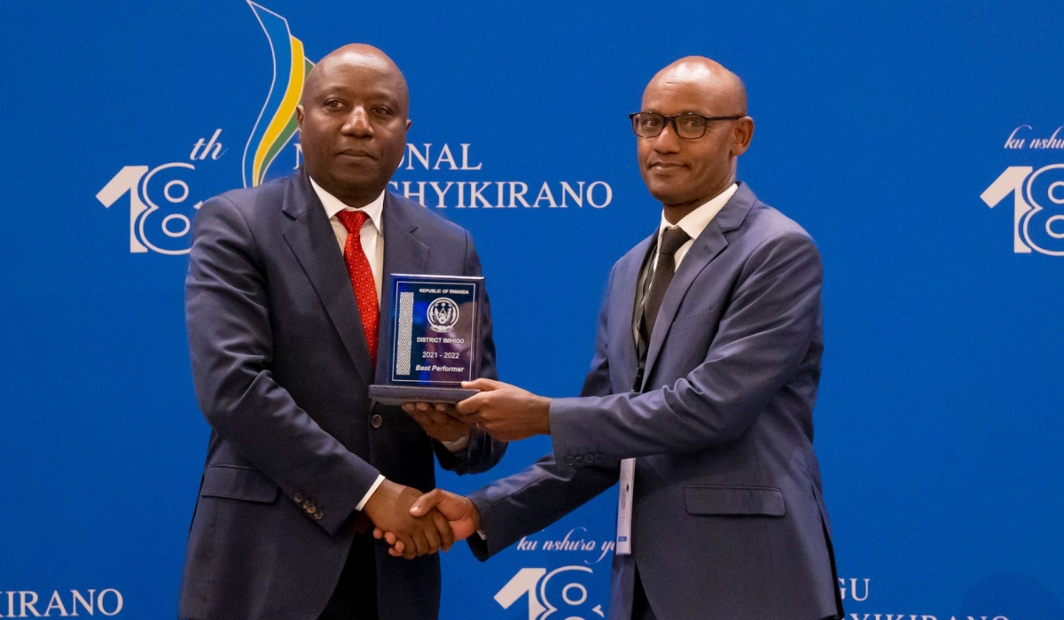 Prime Minister Edouard Ngirente hands over the award to Mayor of Nyagatare District as the district tops others in performance  during the presentation of results of districts’ performance evaluation at Umushyikirano.