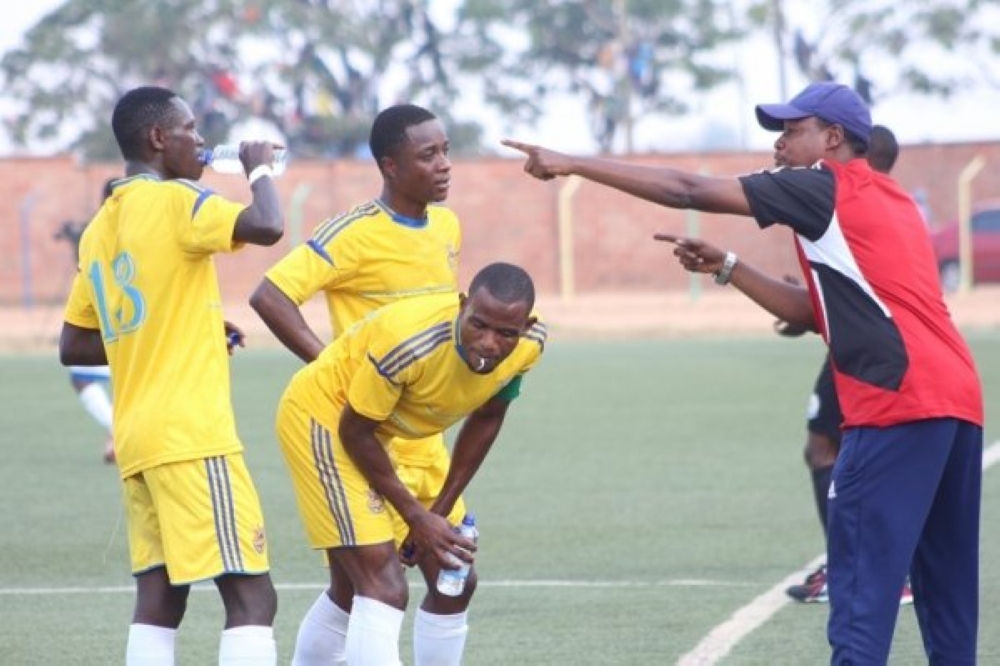 AS Muhanga head coach Abdu Mbarushimana gives instruction to his players during the game. File